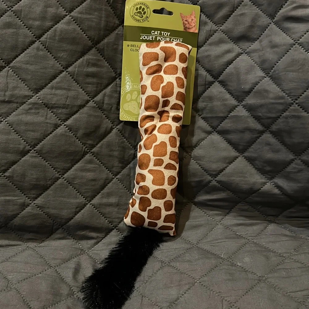 Giraffe print toy with faux fur has jingle bell inside